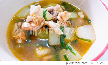 Tom yam chicken and hatched marinade in a tableware bowl. 68021258