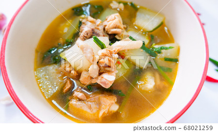 Tom yam chicken and hatched marinade in a tableware bowl. 68021259