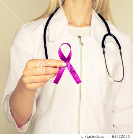 Female doctor in white uniform with purple 68022050