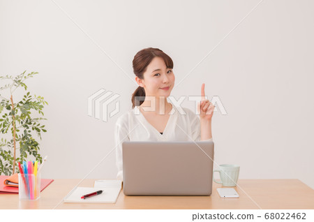 Business woman working in the office, pointing pose Business woman working in the office, pointing pose 68022462