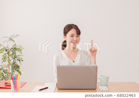 Business woman working in the office, pointing pose Business woman working in the office, pointing pose 68022463