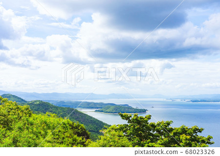 Beautiful scenery views of nature with a large reservoir above the Srinagarind Dam at Rai Ya Yam viewpoint in Si Sawat District, Kanchanaburi Thailand. Beautiful scenery views of nature with a large reservoir above the Srinagarind Dam at Rai Ya Yam viewpoint in Si Sawat District, Kanchanaburi Thailand. 68023326