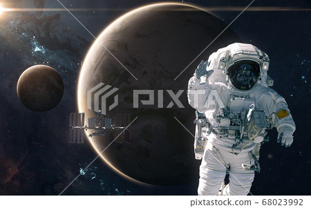 Astronaut and ISS on background of Earth and Moon. Solar system 68023992