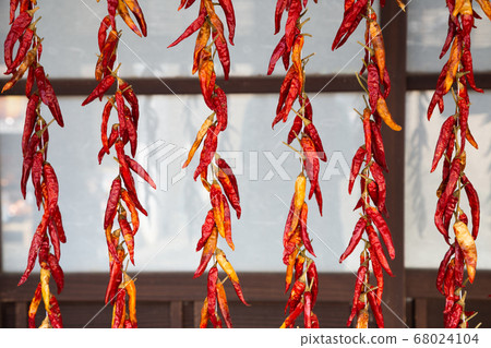 Dried red hot chili peppers at Japanese old village Uchiko town in Ehime, Shikoku, Japan 68024104
