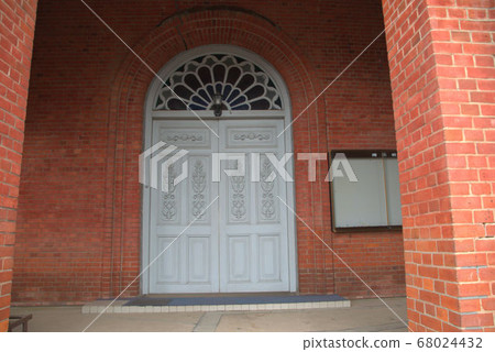 The door of the church with a retro feel is up Imamura Catholic Church 68024432