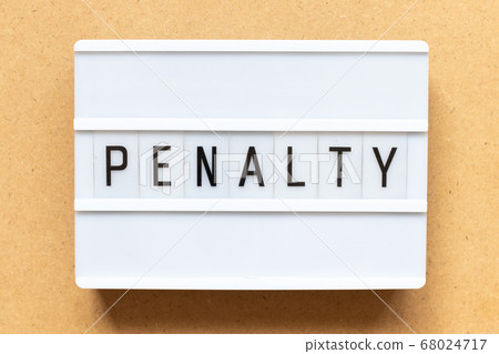 Lightbox with word penalty on wood background 68024717