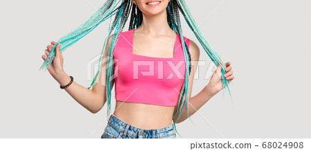 millennial generation woman blue dyed hair braids 68024908