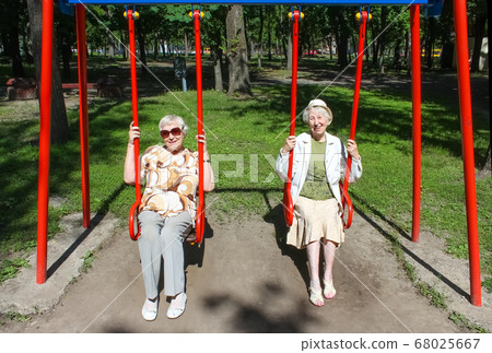 two mature women in park 68025667