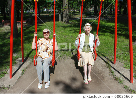 two mature women in park 68025669