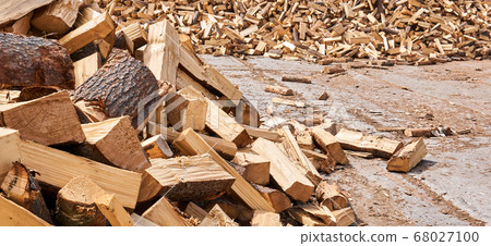 pile of firewood lies on concrete outdoor 68027100