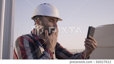 Engineer having a video call 68027612