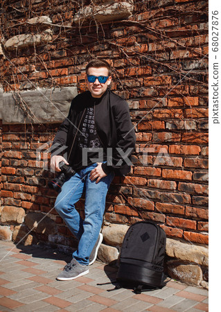 photographer sunglasses and black clothes backpack photographer sunglasses and black clothes backpack 68027876