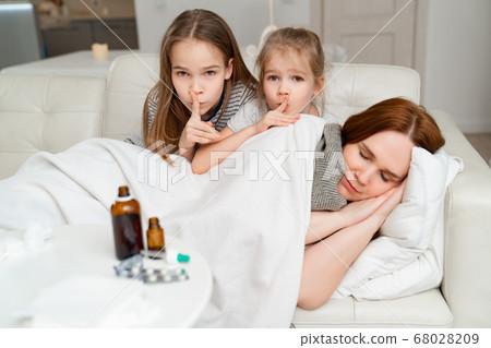 daughters do not interfere with sick mother sleep. 68028209