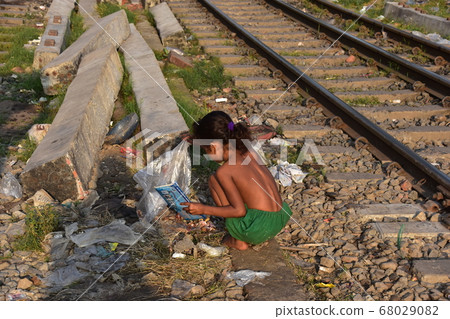Dhaka, the capital of Bangladesh, a girl who collects trash discarded on the railway 68029082