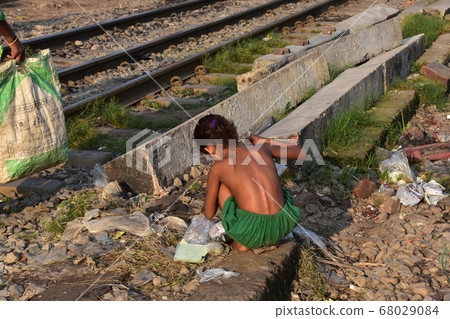 Dhaka, the capital of Bangladesh, a girl who collects trash discarded on the railway 68029084