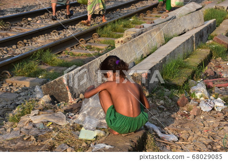 Dhaka, the capital of Bangladesh, a girl who collects trash discarded on the railway 68029085
