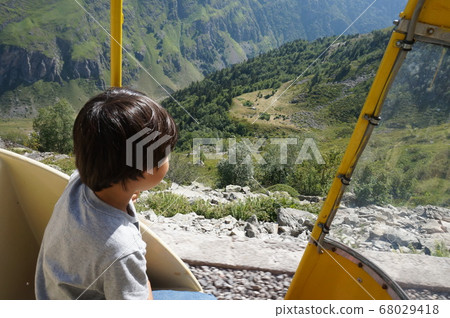 A scene with a boy riding a Petit Tran in Altost A scene with a boy riding a Petit Tran in Altost 68029418