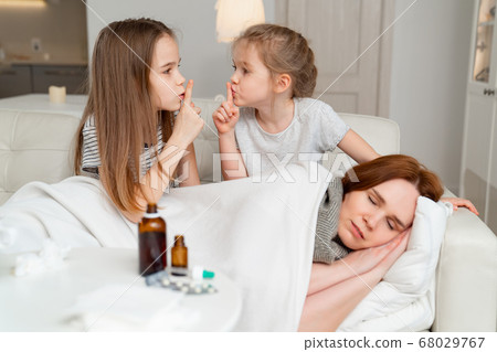 children do not interfere with sick mom sleep. 68029767