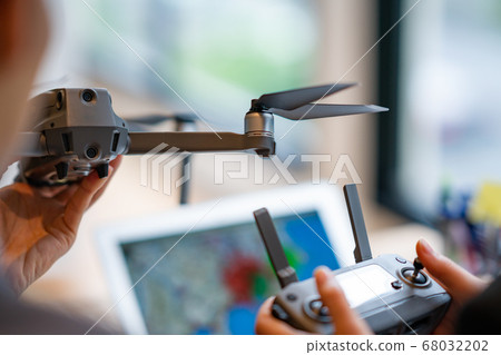 Drone business suit office two men and women frontal in-flight business talk greeting aerial view am bright 68032202