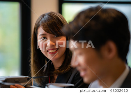 Drone business suit office two men and women business talk aerial view am bright windowside window city center operation 68032610