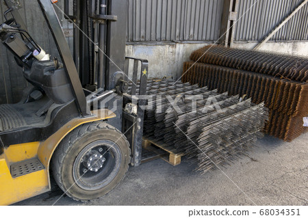 forklift carrying a stack of rebar mesh forklift carrying a stack of rebar mesh 68034351