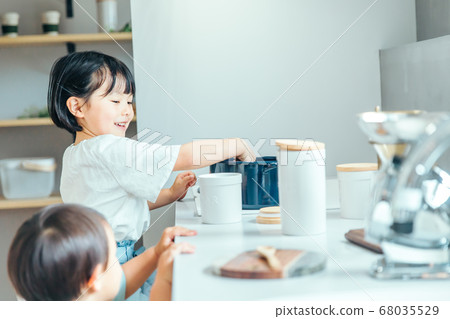 A girl cooking in the living kitchen girl kids kitchen A girl cooking in the living kitchen girl kids kitchen 68035529