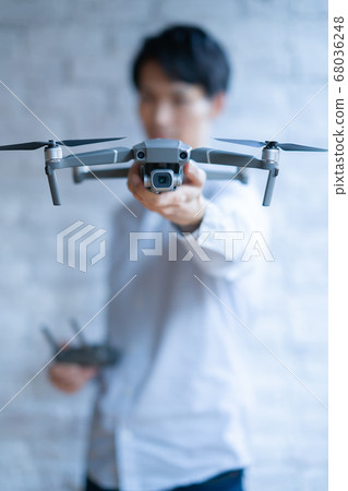 Drone business casual office man 1 person business talk aerial view window near window handheld hobby airplane Drone business casual office man 1 person business talk aerial view window near window handheld hobby airplane 68036248