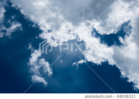 floating white cloud in bright blue sky in sunny day 68036321