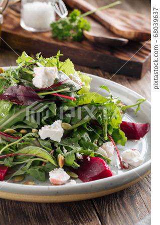 Healthy vitamin salad with beetroot cheese greens 68039637