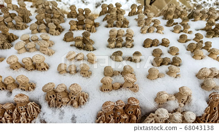 Fairy Chimneys at the valley covered with snow in winter in Goreme, Cappadocia, Turkey 68043138