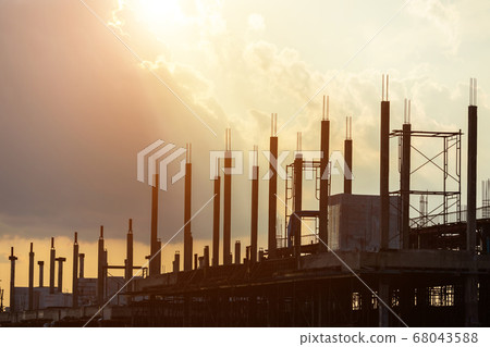 Silhouette of construction worker working on site 68043588