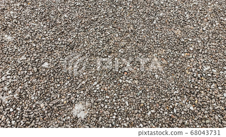 Lots of small gray wet rock stones on the road in Anatolia Lots of small gray wet rock stones on the road in Anatolia 68043731