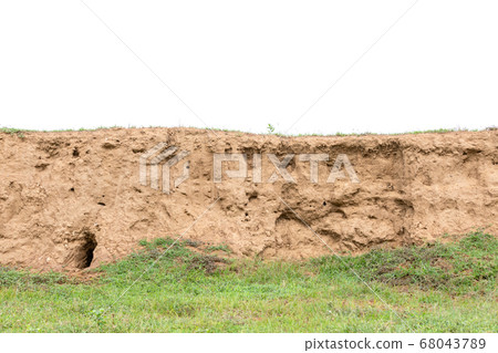 Layers of soil with green grass growing isolated Layers of soil with green grass growing isolated 68043789
