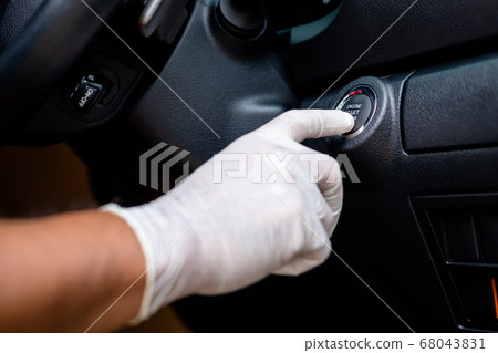 Hand wearing white gloves and pushing button Hand wearing white gloves and pushing button 68043831