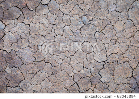 Grey dry soil or mud texture for background Grey dry soil or mud texture for background 68043894