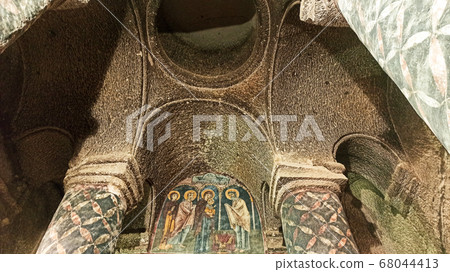 Gumusler Monastery from inside. Sacred Frescos on the wall of the Cave Church in Cappadocia Gumusler Monastery from inside. Sacred Frescos on the wall of the Cave Church in Cappadocia 68044413