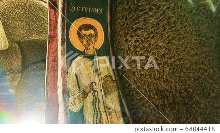 Gumusler Monastery from inside. Sacred Frescos on the wall of the Cave Church in Cappadocia Gumusler Monastery from inside. Sacred Frescos on the wall of the Cave Church in Cappadocia 68044418