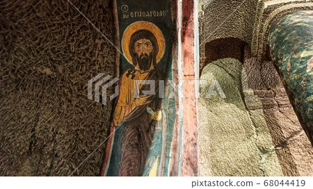 Gumusler Monastery from inside. Sacred Frescos on the wall of the Cave Church in Cappadocia Gumusler Monastery from inside. Sacred Frescos on the wall of the Cave Church in Cappadocia 68044419