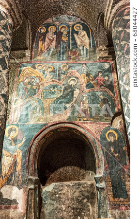 Gumusler Monastery from inside. Sacred Frescos on the wall of the Cave Church in Cappadocia Gumusler Monastery from inside. Sacred Frescos on the wall of the Cave Church in Cappadocia 68044427