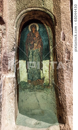 Gumusler Monastery from inside. Sacred Frescos on the wall of the Cave Church in Cappadocia Gumusler Monastery from inside. Sacred Frescos on the wall of the Cave Church in Cappadocia 68044430