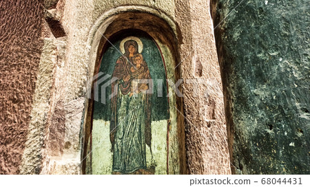 Gumusler Monastery from inside. Sacred Frescos on the wall of the Cave Church in Cappadocia Gumusler Monastery from inside. Sacred Frescos on the wall of the Cave Church in Cappadocia 68044431