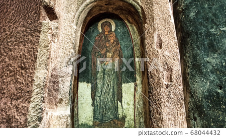 Gumusler Monastery from inside. Sacred Frescos on the wall of the Cave Church in Cappadocia Gumusler Monastery from inside. Sacred Frescos on the wall of the Cave Church in Cappadocia 68044432