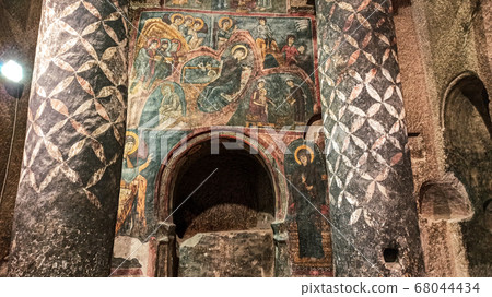 Gumusler Monastery from inside. Sacred Frescos on the wall of the Cave Church in Cappadocia Gumusler Monastery from inside. Sacred Frescos on the wall of the Cave Church in Cappadocia 68044434