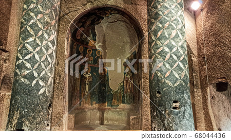 Gumusler Monastery from inside. Sacred Frescos on the wall of the Cave Church in Cappadocia Gumusler Monastery from inside. Sacred Frescos on the wall of the Cave Church in Cappadocia 68044436