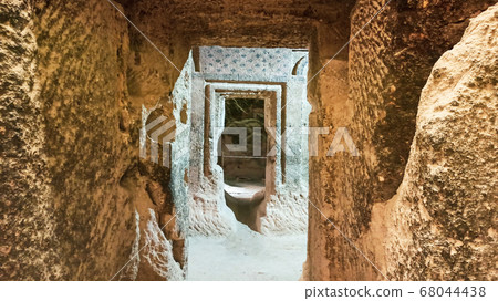 Gumusler Monastery from inside. Sacred Frescos on the wall of the Cave Church in Cappadocia Gumusler Monastery from inside. Sacred Frescos on the wall of the Cave Church in Cappadocia 68044438
