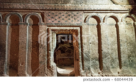 Gumusler Monastery from inside. Sacred Frescos on the wall of the Cave Church in Cappadocia Gumusler Monastery from inside. Sacred Frescos on the wall of the Cave Church in Cappadocia 68044439