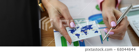 Woman working at financial report 68044644