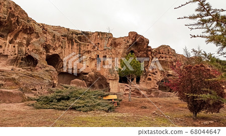 Ancient and secret Gumusler ruins and the monastery surrounded by walls and stones in Cappadocia, Gumusler, Nigde 68044647