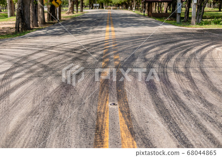 Stripe of car wheel from asphalt on the road in 68044865