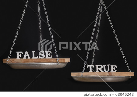 Words truth and false on scales. Disbalance. Black Words truth and false on scales. Disbalance. Black 68046248